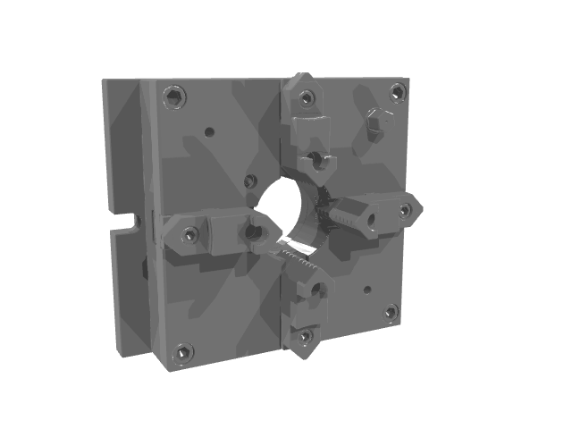 A square gray industrial clamping block shown from a slightly angled perspective, highlighting a circular central passage.